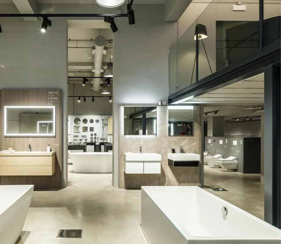 Bathroom fixture showroom with tubs, vanities, and lighted mirrors