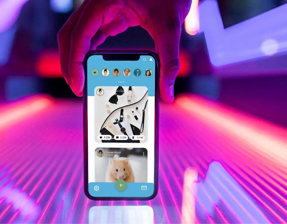 Hand holding a phone showing the training app's photo feed